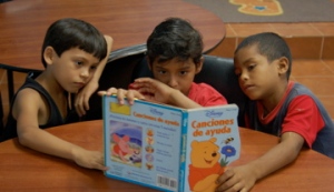 ulises, eric + armando reading in the library 